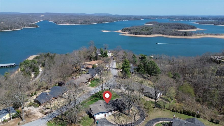 Beaver Lake Area Home with Year-Round Views.    
Enjoy stunning lake views all year long from this beautiful 3-bedroom, 3-bath home near Prairie Creek Marina at Beaver Lake. The home features two spacious living areas, each with its own fireplace, and huge windows plus sliding glass doors on both levels that fill the home with natural light and frame the water views. Updates include two brand-new decks, modern kitchen appliances, and a new backyard fence with a dedicated dog area—perfect for pets or outdoor gatherings. With room to relax and entertain inside and out, this property combines comfort, privacy, and unbeatable lake living.