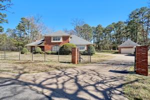 If a nice home with a pool, a shop on two lots behind a gate in Heartland subdivision is what you are looking for stop what you are doing and take a look. This one has five bedrooms, three baths, large living room with fireplace, totally updated kitchen, a pool area to die for and a location that can't be beat. Don't let this house get away.