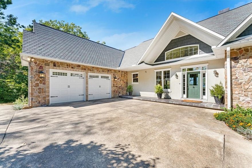 Offered for the first time this custom-built lakefront home sits on 3.05 acres in one of Eureka Springs' most coveted waterfront locations. A 12x30 private dock invites lakeside living! Inside, geothermal heated floors provide year-round comfort and a brand-new roof for peace of mind. The heart of the home opens to a screened porch off the kitchen with tranquil lake views, while a woodburning fireplace anchors the living space with warmth and charm. Expansive windows flood the home with natural light and multiple balconies offer elevated views of the water and surrounding woods. The primary suite is a true retreat with a soaking tub and serene vistas. Every detail reflects thoughtful design and timeless craftsmanship, creating a seamless blend of luxury and nature.