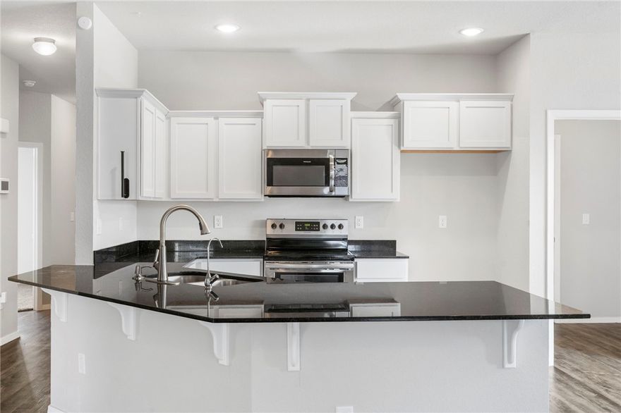 Find your way home to this freshly painted, move-in-ready solar home in the highly rated Bentonville School District.

This 3-bed, 2-bath home blends style, comfort, and convenience in one perfect package. Step inside to vaulted ceilings that create an airy, open feel through the living room, hallway, and kitchen. The heart of the home shines with 3cm granite countertops, stainless steel appliances, staggered cabinets, LED can lighting, and a reverse osmosis water filter.

The master suite is your private retreat with a spa-like bath featuring a jetted tub, stand-alone shower, marble counters, and comfort-height toilets.

Modern touches include fresh paint, luxury vinyl flooring, a smart thermostat, and a water softener—ensuring this home is truly move-in ready. Outside, you’ll find a privacy-fenced backyard, storage shed, and quick access to the dog park and future community center.