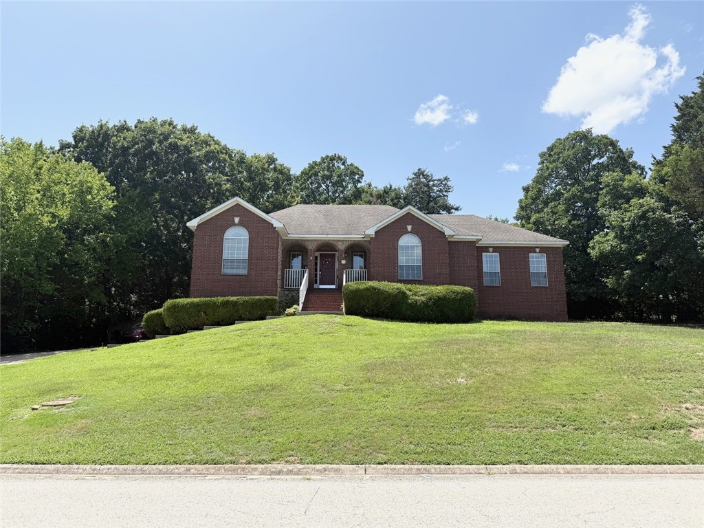 Don't miss out on this beautiful home in a fantastic location! Fully finished basement offers second living space and game room. There is lots of room in this 2,858 SF home. It features 4 bedrooms and 3 baths, a gas-log fireplace, beautiful wood laminate and ceramic tile flooring. The kitchen boasts bright cabinetry, attractive backsplash, a bar that seats at least 4, plus a nice walk-in pantry. The primary bath has seperate his/her vanities - very nice. Beautiful back deck to truly enjoy the outdoors has a covered area perfect for a grill and chairs to relax and entertain. Enjoy the spacious 0.36 AC yard with a privacy fence. Walk to trails and the neighborhood pool! Come and see this spacious home today!