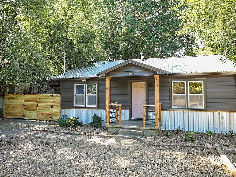 This charming home in the heart of South Fayetteville blends convenience and tranquility effortlessly. Just steps from campus, nature trails, and the lively Dickson Street, it's your gateway to a vibrant lifestyle. Sitting on a generous double lot of 13,068 sqft, this property offers ample outdoor space for your creativity to flourish.
In 2015, the home underwent a full-scale renovation that included the addition of a modern kitchen and a luxurious primary bath. All new HVAC, electrical, insulation, and plumbing was also installed in 2015. The roof was upgraded to a durable metal roof in 2018, ensuring both style and longevity. Most recently, in September 2023, a comprehensive hallway bathroom makeover was completed, accompanied by fresh coats of paint both inside and outside.