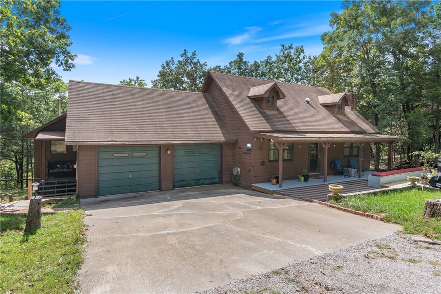 Set on a gently sloping, beautifully landscaped lot in a quiet, scenic neighborhood, this updated 3-bed, 3-bath home stands out with thoughtful renovations. The kitchen and bathrooms have been tastefully redone, as well as updated flooring and fresh paint enhancing the interior. A spacious living room with cathedral ceilings and a dramatic stone wood-burning fireplace creates a striking focal point. The formal dining room includes a built-in hutch, adding character and functionality. An oversized 2-car garage provides ample storage and access to a private in-law suite with its own entrance, wood stove, full bath with walk-in shower, and bonus space—perfect for guests, hobbies, or a home office. Three separate decks surround the home, offering multiple options for outdoor relaxation. The backyard includes a 80sqft storage shed. Conveniently located in near Table Rock Lake, marina, recreation center, golf courses, shopping, and dining. Adjacent lots at 10 & 12 Twin Peak available—combine for up to 2.45 acres.
