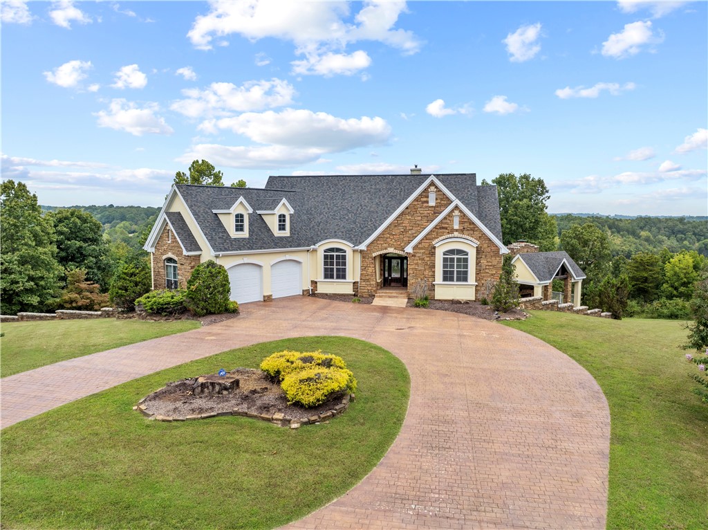 Welcome to your new home! This executive property, situated on 4.13 acres, offers breathtaking panoramic views of the picturesque Ozark Mountains. As you step inside, you'll be embraced by a world of comfort and luxury. Plenty of space for everyone, as this home features four bedrooms, with the option for a fifth. For a relaxing evening, retreat to the cozy gazebo and enjoy the outdoor fireplace, surrounded by the soothing sounds of nature. A new roof was installed in September 2024. The property is conveniently located just 30 minutes away from the Buffalo National River to the south and the vibrant entertainment hub of Branson, MO to the north. Whether you explore the beauty of the Ozarks or indulge in a round of golf at professional-style courses, you'll find endless opportunities for enjoyment. Additionally, you have your choice of four stunning lakes, all within a 30-minute drive.