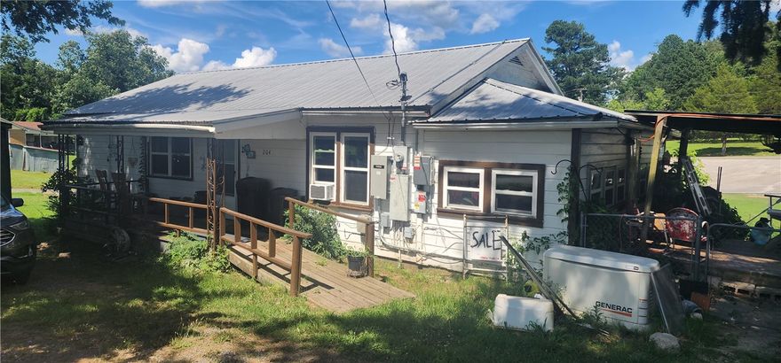 Welcome to this 3-bedroom, 1-bath home offering a perfect blend of comfort and sustainability.  This home features a durable metal roof and energy-saving solar panels to help lower utility costs.
Step inside to find a spacious living area with a mix of hardwood and vinyl plank flooring, adding warmth and character. The kitchen is fully equipped, and all major appliances are included.  Central heating and air ensure year round comfort.  Enjoy outdoor living with a convenient covered deck, perfect for relaxing or entertaining. A storage shed provides additional space for tools, equipment, or hobbies.