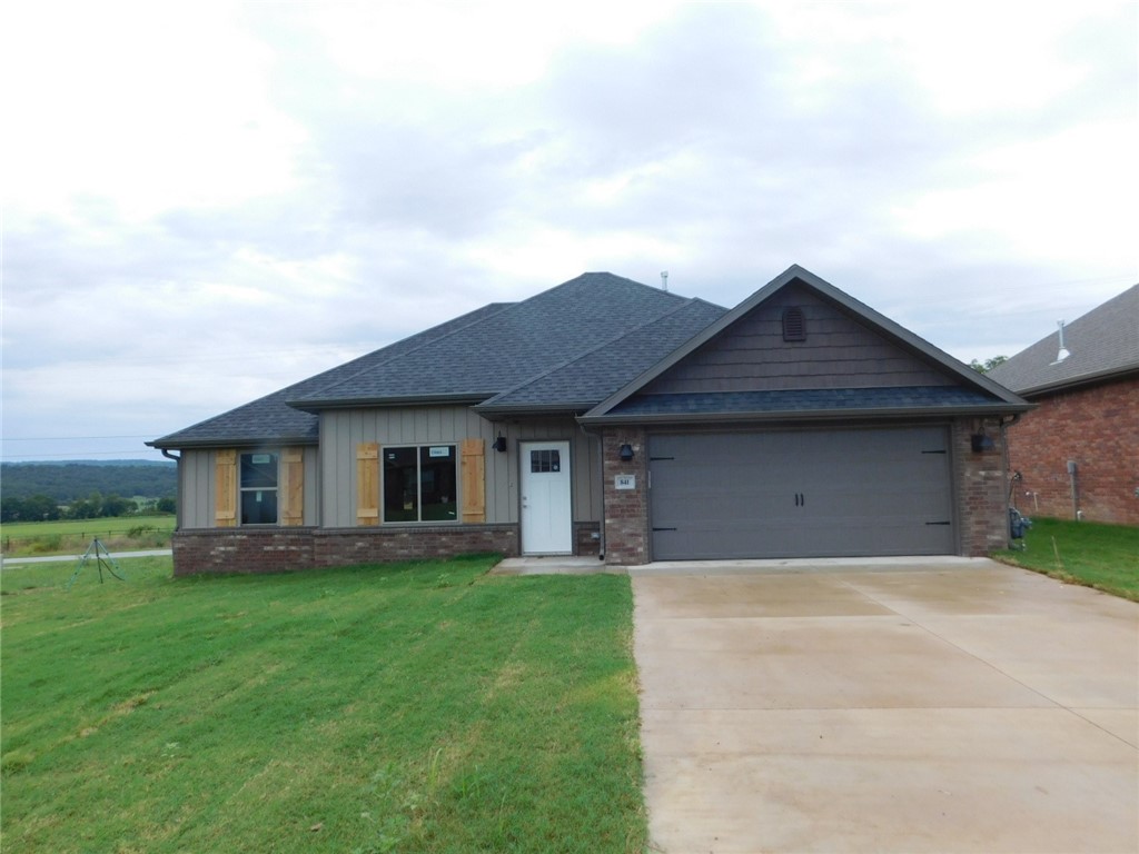 New home featuring 1,443 sq. ft., 3 BR, 2 BA, 2 car garage, fireplace with built-in bookshelves, granite, split bedrooms, 2" blinds, and wood plank vinyl flooring in living room, dining, kitchen & baths. This home also features covered patio, gutters, fully sodded yard & fenced backyard. Beautiful view. Builder will pay $2,500 of buyers closing cost & prepaids