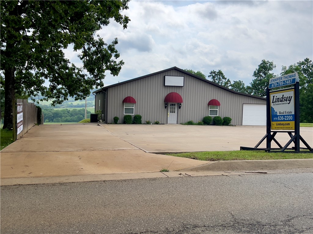 Location, location, location!! Don't miss this RARE investment opportunity. The multiple zoned office space is right off Highway 412 and just 1/2 a mile from Huntsville Wal-Mart. This 2000 sq foot building, plus attached 480 ft of garage contains 3 offices, one large meeting/conference room and 2 restrooms. Location is on point with 2 street frontages. The property is inside city limits and being dual use zone (DUZ can be used as commercial or residential. This building has ALL city utilities. 1/2 an acre MOL, new survey will be provided at closing.