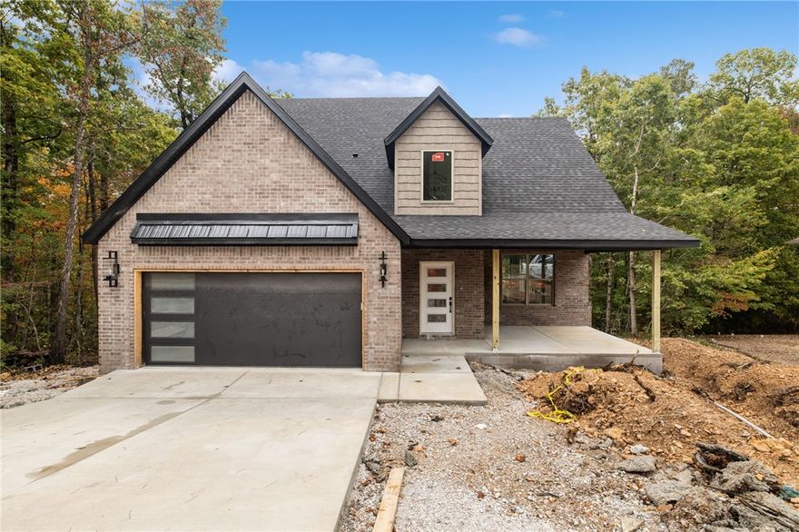 This brand new beauty has such a cool and thoughtful floor plan. Youāll love the curb appeal, the convenient location with trail access nearby, and being part of the Bentonville School District. Step inside to an open living area filled with natural light, a vaulted ceiling with beautiful beam details, and a cozy fireplace that makes it instantly feel like home. The kitchen features custom cabinets and 3cm granite throughout ā perfect for everyday cooking or hosting friends. The main-level primary suite offers a relaxing retreat with dual vanities and a full custom tile shower. Upstairs youāll find three more spacious bedrooms and another full bath, giving everyone their own space.
Enjoy morning coffee on the huge covered front porch, or unwind in the evening on the covered back deck overlooking your yard. The front yard will be landscaped and sodded, and thereās still time to make some selections to truly make it yours.
Preferred lender offering a one point rate buy down to get as low as 4.875%.