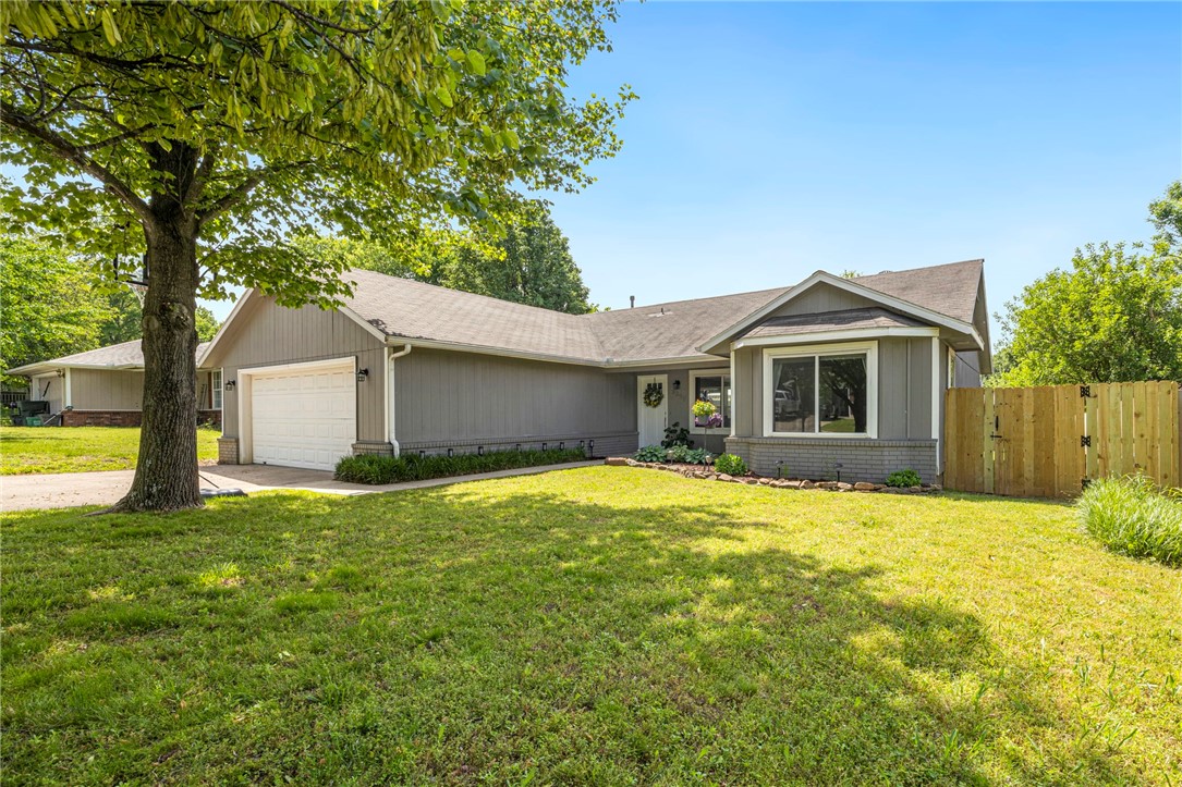 This well-located 3 bedroom 2 bathroom home provides comfortable living in a highly desirable location. The light-filled space offers a great split floor plan, vaulted ceilings in the living room, bamboo flooring, butcher block countertop and fresh paint. Lovely landscaping and a fully fenced yard make the outside inviting and usable. You'll love being tucked away in a neighborhood yet close to restaurants & shopping. Home is less than a 10 minute drive to the University, within walking distance of the UofA Bus Route, and next to Bryce Davis/Iams Dog Park. City planned expansions for the neighborhood are on the horizon with plans to expand Bryce Davis Park as well as the Salem Road to Mt Comfort extension. Come tour your next home!