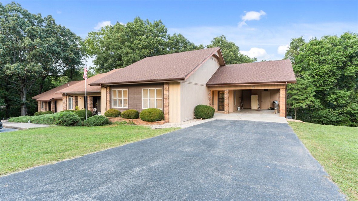 Must see remodeled townhome tucked away among the peaceful landscape of Bella Vista! Inviting & cozy floor plan. Large back deck with ground access. What's new? Paint, flooring, hvac, water heater, fixtures, kitchen appliances...it's ready to go and ready for YOU to make your new home. Water bill is included with townhome dues. Enjoy all that Bella Vista has to offer and more with this turnkey property.