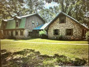 Beautiful Home On The Scenic Arkansas River In Clarksville. This Over 2700 sq. ft. Home Borders the River. The Very Well Constructed Home features 4 Bedrooms, 2.5 Bath, A Formal Dining Room, Fireplace In the Living Room, as well as, downstairs in the basement. You Can Enjoy The Outdoors With Your Choice of 2 Large Decks, One on the Basement Level and One on the Main Level. There's a large 2 car attached garage, but, you also have a 2,000 Sq. Ft., well Insulated Shop Building With Electricity for more parking and storage. Then, if that's not enough to peak your interest, it comes with 31.44 Acres m/l, That Has a Pole Barn & 2 Ponds. All Data Is Taken From The County Courthouse Records. Don't let this One Owner Home, on the River, Slip Through You Hands, Make Your Appointment to See It