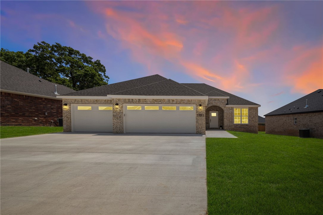 Contemporary living meets small town charm! This quality, all-brick new construction home features an incredible open concept/split floorplan with on-trend upgrades like luxury vinyl plank flooring, a drop zone with built-ins off the 3-car garage, ceiling-height kitchen cabinets, granite countertops, under-cabinet lighting, pocket office with double doors for privacy, pantry, gas fireplace, and covered deck. You’ll love the easy flow of the laundry room connecting to the owner’s suite! Situated conveniently off the bypass in one of Prairie Grove’s most desirable areas, Mountain View Estates gives you a quick commute to i-49 whilst cozying into a quaint downtown scene best known for antiquing, aquatic park, and its rich history. Become a part of this vibrant, tight-knit community plus enjoy fast access to all your favorite Fayetteville amenities... truly, this wonderful home offers the best of both worlds!