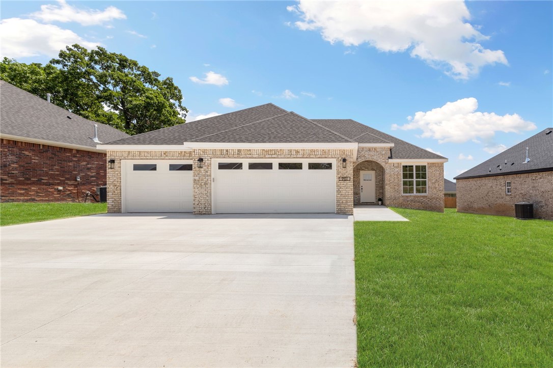 Contemporary living meets small town charm! This quality, all-brick new construction home features an incredible open concept/split floorplan with on-trend upgrades like luxury vinyl plank flooring, a drop zone with built-ins off the 3-car garage, ceiling-height kitchen cabinets, granite countertops, under-cabinet lighting, pocket office with double doors for privacy, pantry, gas fireplace, and covered deck. You’ll love the easy flow of the laundry room connecting to the owner’s suite! Situated conveniently off the bypass in one of Prairie Grove’s most desirable areas, Mountain View Estates gives you a quick commute to i-49 whilst cozying into a quaint downtown scene best known for antiquing, aquatic park, and its rich history. Become a part of this vibrant, tight-knit community plus enjoy fast access to all your favorite Fayetteville amenities... truly, this wonderful home offers the best of both worlds!