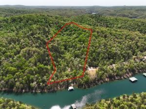 Discover the beauty of Lot 9 in Bel Lago Estates – 9.24 acres with breathtaking views of Beaver Lake! This stunning tract offers multiple building site options, whether you’re dreaming of expansive lake views from above or a serene, lakefront build tucked among the trees.
While no boat dock is available, the Big Clifty boat ramp is just minutes away, giving you quick and easy lake access for all your boating and fishing adventures.
This property offers the perfect setting for your primary residence or a custom vacation retreat—a peaceful escape with room to roam and views to remember. Located near Big Clifty Park for hiking, swimming, and picnic fun, and just a short drive to the charming town of Eureka Springs, where shopping, dining, and entertainment await.
Come experience all Beaver Lake living has to offer—privacy, beauty, and convenience wrapped into one incredible opportunity.