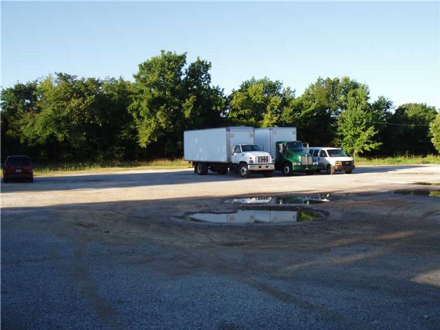 Excellent re-development opportunity. Property is located on a busy corner lot and is zoned I-2. Site consists of 2.68 acres MOL. New housing development being built across the street. Property has an existing 1680 square foot structure formally used for commmercial office and limited food service. The existing building could be renovated but value is the land.