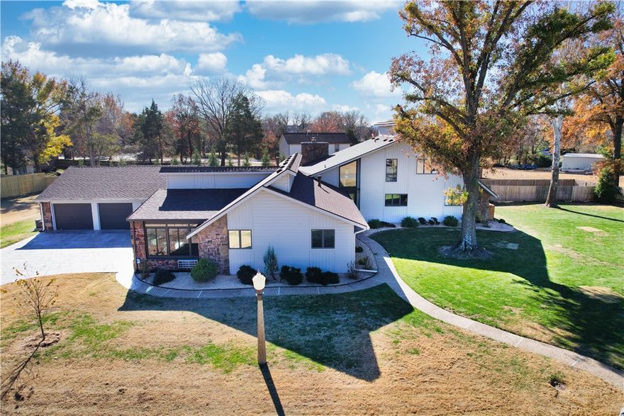 This is a rare gem! Located minutes from Pinnacle Hills Promenade, Mercy Hospital, Top Golf, Walmart AMP, and all the shopping and restaurants that make Rogers, AR the place to be! And a short commute to Bentonville, too. This mid-century style beauty is 4286 Square Feet of perfection. Situated on a .63 acre lot, this home has 5 bedrooms, 3 full baths, media room, game room with bar/kitchenette, and has been meticulously maintained and upgraded. It boasts a new roof with high impact shingles, new gutters, new siding, new stamped and stained driveway, and new Epoxy floor in garage (2024). 4 car garage is heated and cooled with a workshop area. Pool was fully updated by Burton Pools in 2023. Irrigation system has been updated and includes drip irrigation for the garden beds. Whole house Generac will give you peace of mind. This home is a must see!