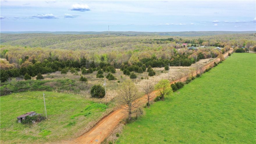 Enjoy the privacy and views of this 7.7± acre mountain-top property located in scenic Carroll County, Arkansas. This tract offers county road frontage with public water and electricity available, making it an excellent choice for a future home, cabin, or recreational retreat.

The elevated setting provides a peaceful atmosphere with the potential for long-range mountain views. Whether you’re looking to build, invest, or create a weekend getaway, this property offers the convenience of utilities while maintaining a rural, natural setting.
Property Features:
   •   7.7± acres
   •   Mountain-top location
   •   County road frontage
   •   Public water available
   •   Electricity available
   •   Quiet rural setting
   •   Ideal for residential or recreational use

Property is located near the Buffalo River, Compton and Ponca area.

All property information is believed to be accurate but not guaranteed. Buyers to verify utilities, acreage, and restrictions