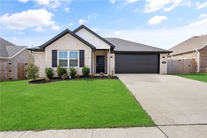 Beautiful like-new, one-level home offering comfort, style, and convenience! This 3-bedroom, 2-bath property features a desirable split floor plan, providing privacy between the spacious primary suite and secondary bedrooms. The all-brick exterior adds timeless curb appeal and low-maintenance durability. Inside, you’ll find an inviting layout with modern finishes and a light-filled living space perfect for everyday living or entertaining. The kitchen flows seamlessly into the main living area, creating a functional and open feel. Situated in the highly sought-after Bentonville School District, this north-facing home is ideally located just 10–15 minutes from the Walmart campus, shopping, dining, and entertainment. With 1,685 sq ft of thoughtfully designed space, this move-in-ready home is the perfect blend of location, quality, and convenience!