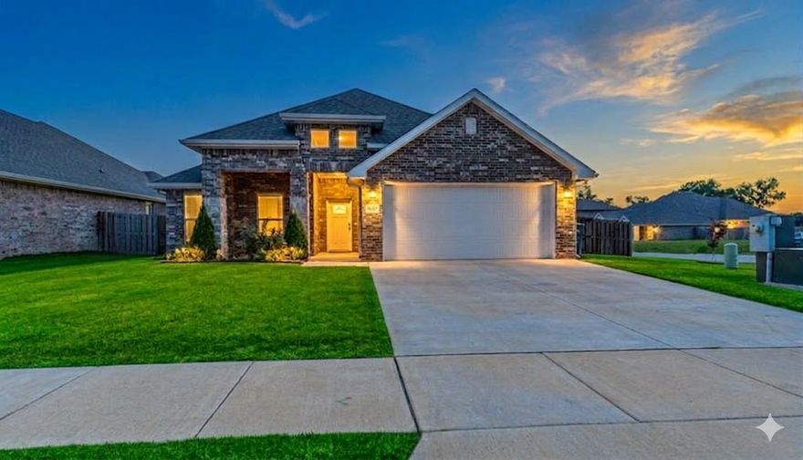 Welcome to this thoughtfully designed 1993sf 3-bedroom, 2-bath nearly-new construction home. The split floor plan features an open concept spacious living area flooded w/ natural light & corner gas fireplace. The pristine kitchen, complete w/ a gas stove, has a large pantry & ample counter space. The primary suite w/ double vanities is privately located & includes a walk-in closet directly connected to the laundry room for convenience. Two secondary bedrooms are set off the generous foyer w/ a cozy seating nook, creating a welcoming & functional layout. Situated on a large .24-acre corner lot, the expansive backyard boasts a covered patio overlooking a blueberry bush, cherry, plum & peach trees, all enclosed by a wood privacy fence. The two-car garage includes a unique kitchenette w/ a 4-burner gas cooktop, exterior-vented hood, & sink, ideal for entertaining. Seller is offering a 2-year Home Warranty. Located near Centerton Middle & High School, w/ quick access to shopping, dining, parks, & Hwy 72.