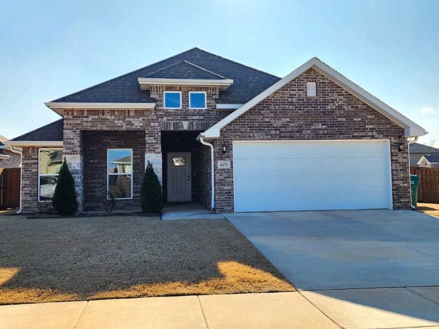 Welcome to this thoughtfully designed 3-bedroom, 2-bath home. The split floor plan features an open concept spacious living area flooded with natural light and corner gas fireplace. The pristine kitchen, complete with a gas stove, has a large pantry and ample counter space. The primary suite is privately located and includes a walk-in closet connected directly to the laundry room for convenience. Two secondary bedrooms are set off the generous foyer with a cozy seating nook, creating a welcoming and functional layout. Situated on a corner lot, the backyard boasts a covered patio overlooking a blueberry bush, cherry, plum and peach trees, all enclosed by a wood privacy fence. The two-car garage includes a unique kitchenette with a 4-burner gas cooktop, exterior-vented hood, and sink, ideal for entertaining. Located near Centerton Middle and High School, with quick access to shopping, dining, parks, and Hwy 72. Ring doorbell and two cameras, refrigerator, washer, and dryer convey with an acceptable offer.