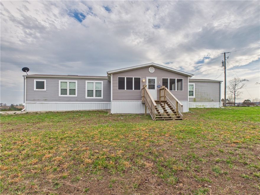 "Move right into this immaculate, like-new home featuring modern finishes and a pristine interior that still feels brand-new. The bright, inviting layout is anchored by a stunning sunroom, providing the perfect spot to soak in natural light and enjoy the scenic views in year-round comfort. Step outside to discover a true country paradise on 7 beautiful acres. This expansive property provides ultimate privacy while remaining conveniently located just a half-mile off the pavement. Car enthusiasts and hobbyists will love the oversized two-car detached garage. Whether you’re looking for a peaceful retreat or space for a small-scale farm, this property offers endless possibilities. For ultimate peace of mind, the property comes equipped with a whole-house backup generator, ensuring you're never without power.