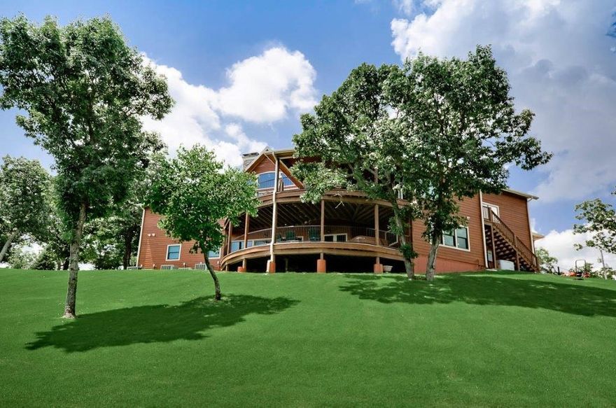 Every man's dream with a 30x28 Oversized Garage (attic storage above) on main level and an additional oversized garage on lower level that includes work shop. And a kitchen, even a craft room -- all fit for the queen of the house. Stunning Home for those who deserve only the best. Breathtaking views! Huge master w/ an amazing en-suite; Whirlpool tub, Dual showers w/ steam, custom woodwork & the list goes on. Enormous Great Room w/ hand-hewn woodwork, custom Acacia wood floors, Fireplace & more. Family Room downstairs includes wet bar/kitchen area. This home is energy efficient with the best windows, closed-foam + cellulose insulation & HVAC system that money can buy.