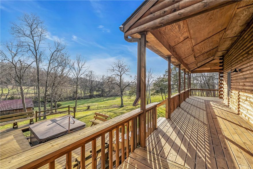 Country estate on 13.28 acres just outside the city limits but only 5 minutes to Drake Field, schools, restaurants and shopping. Custom log-sided home features a new roof on the house and storage shed. Enjoy the pastoral views from the covered wrap-around porch, hot tub, pergola or firepit. Vaulted ceilings, large loft and wood stove anchor the open floorplan. Updated kitchen with granite countertops and island plus a pantry. Private primary suite features walk-in closet, large ensuite bath with jetted tub, dual vanities and separate shower. Handy mudroom with outside door. Perfect for a hobby farm and/or nature enthusiasts with a mix of pasture and woods. Live in now and build in one of many additional home sites. Abundant wildlife with pond and creek. Located off a paved road with circle drive, storage shed, pole barn and chicken coop. Updated water heater, flooring and Andersen windows.