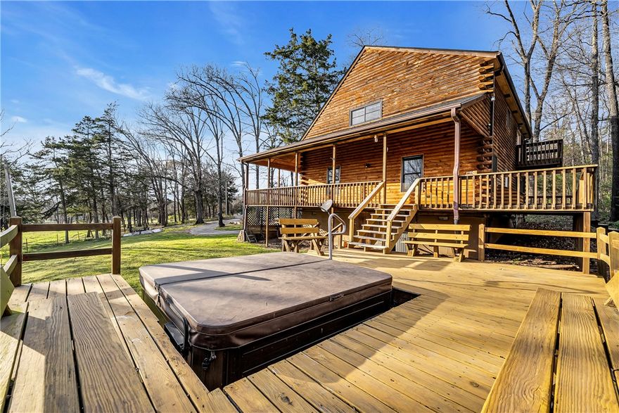 Country estate on 13.28 acres just outside the city limits but only 5 minutes to Drake Field, schools, restaurants and shopping. Custom log-sided home features a new roof on the house and storage shed. Enjoy the pastoral views from the covered wrap-around porch, hot tub, pergola or firepit. Vaulted ceilings, large loft and wood stove anchor the open floorplan. Updated kitchen with granite countertops and island plus a pantry. Private primary suite features walk-in closet, large ensuite bath with jetted tub, dual vanities and separate shower. Handy mudroom with outside door. Perfect for a hobby farm and/or nature enthusiasts with a mix of pasture and woods. Live in now and build in one of many additional home sites. Abundant wildlife with pond and creek. Located off a paved road with circle drive, storage shed, pole barn and chicken coop. Updated water heater, flooring and Andersen windows.