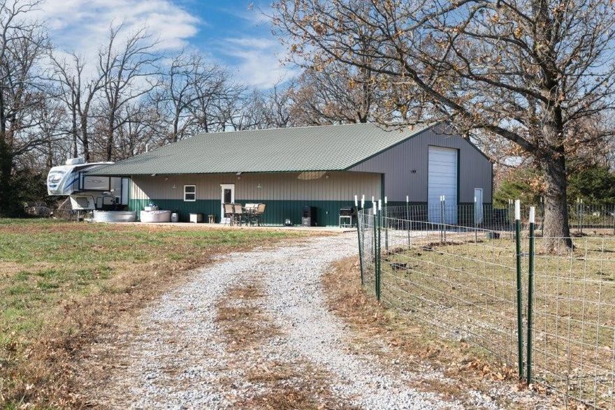 Want to be secluded (see the stars at night) and still only be 15 minutes from town? This Barndominium is the place for you! 1200 SF of house and 1200 of SF shop. See the deer, have your own cattle or horses and of course, chickens! 2 RV hookups. All surrounded by beautiful wooded acres!