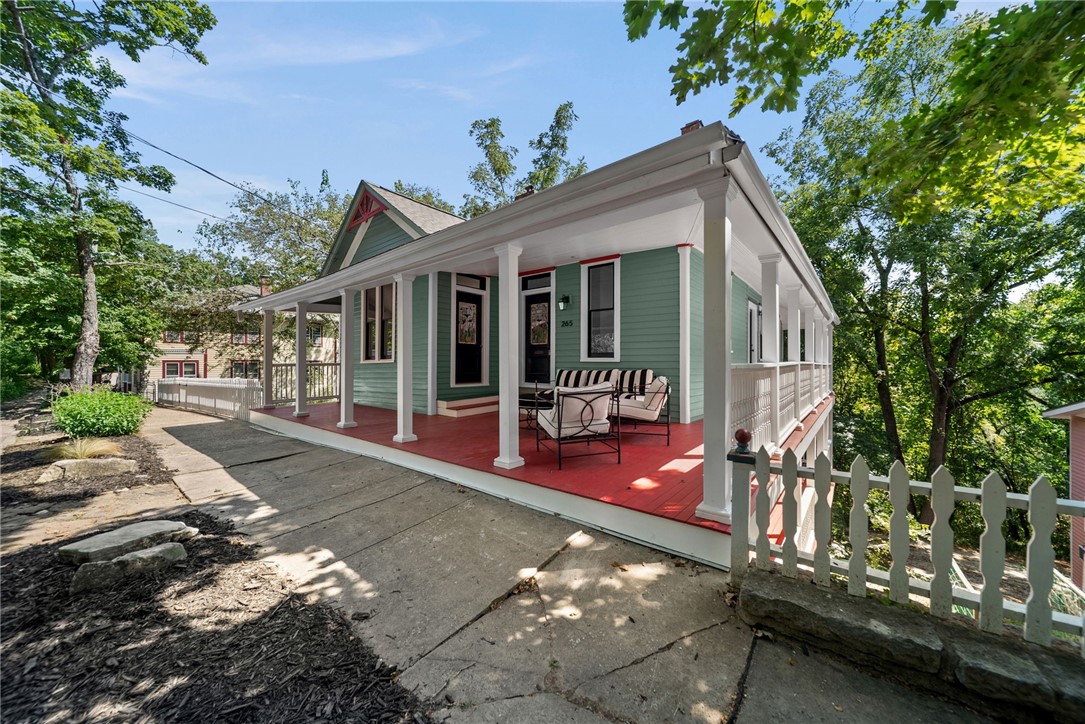 Stunning circa 1900 Victorian home is located on the iconic Historic Loop! Remodeled both inside & out(almost complete), this one boasts fabulous character & unique architectural details. Enjoy coffee on a massive front porch, open the gorgeous antique stained-glass door & step into a generous foyer leading you to a fresh & open kitchen/living area filled with light! The cook's kitchen has quartz countertops, gas stove, microwave, stainless fridge & dishwasher. A powder room is located just off the kitchen. A primary suite with full bath is also just steps from front door. Downstairs is a small living area/library with built-ins galore serving as a quiet getaway. Two additional bedrooms share a bath along with the utility/laundry area. From this level you enjoy a private deck on each side. There is a 504 sq ft carriage house just behind the main house with a kitchen, bedroom & bath with off street parking. Just down the street from the Crescent Hotel in historic downtown Eureka Springs, this is a must see!