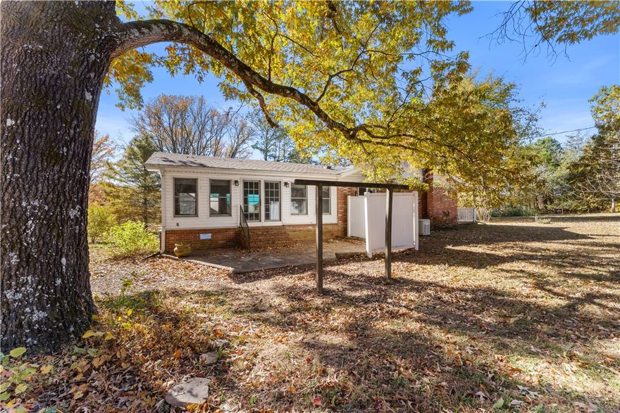 Nestled in the countryside just outside Alma, this home offers a balance of comfort, privacy, and space. Set on four acres of gently rolling land, this charming home is surrounded by mature trees creating a serene retreat minutes from town. Built in 1977, with over 1,500 square feet of living space, you’ll find a spacious living area perfect for relaxing evenings or gatherings. Two comfortable bedrooms and a full bathroom make up the private wing of the home, while a former third bedroom has been opened up to create additional living or office space. Whether you dream of keeping a few animals, starting a garden, or simply enjoying the peace and quiet of rural living, this property provides the space to make those dreams a reality. Located just a short drive from downtown Alma and I-40, the home combines the tranquility of country life with convenient access to shopping, dining, and school. With its inviting character, generous acreage, and endless potential, this property is ready to welcome you home.