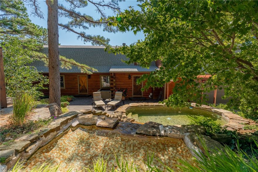 This gorgeous home has some of the best views in Fayetteville & is situated on the back side of Mt. Sequoyah.  Location, Location, Location & a fabulous home too!  Rustic style home w/open concept floor plan w/spacious rooms & fantastic views.  Large LR w/wet bar & dining area w/beautiful hardwood floors open into the completely remodeled kitchen w/upper end appliances.  Master bedroom also has views & a cool master bathroom.  Upstairs features two bedrooms, each with ensuite bath, & an open game room that includes pool table.  Amazing front porch & deck w/FP that overlook front lawn, complete w/koi pond.  Spa pool in the backyard.  Price includes all furniture & appliances.  Don’t miss this rare opportunity!