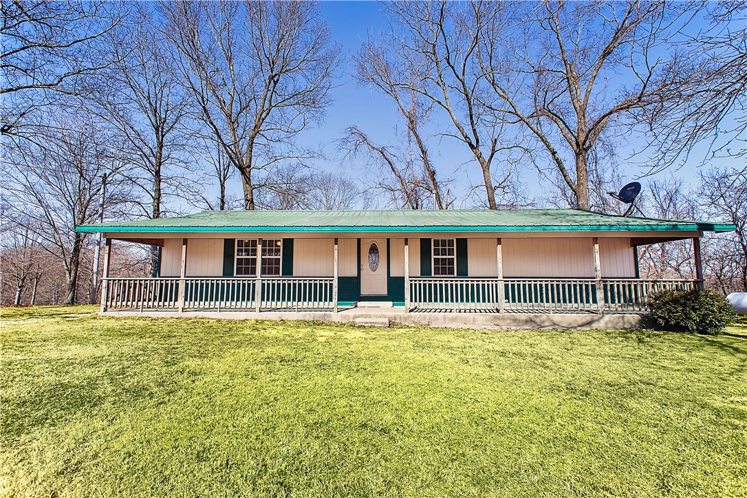 Beautiful 10 acres with matures trees also has large 32'x 60' shop with 14' overhead doors and concrete floors is perfect for Large RV to be stored. Great country setting! Home has nice large bedroom. Plus there is another 12x20 storage building that's great for 4 wheelers or turn into a workshop. 2 electric meters, one for the house and one for the large shop. Amazing shop also has attached office with electric and is fully insulated.