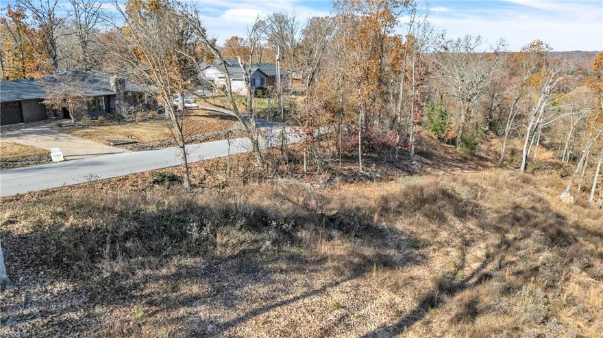 This 6.27-acre Prairie Creek gem is the kind of place folks dream about. Tucked into a beautifully wooded setting on Bluff Drive, it’s just a short walk to Prairie Creek Marina and only 10 minutes to Downtown Rogers. The land is perked, cleared in all the right spots, and ready for whatever you’re envisioning, a private custom build, an executive homesite, or even multiple residences.

The neighborhood has a strong track record, with nearby homes selling between the $400s–$800s, and it’s easy to see why. Peaceful, scenic, and full of that classic lake-area charm.

If lake life has been calling your name, this one’s worth the short drive. Come walk it, breathe it in, and picture what’s possible on a property like this.