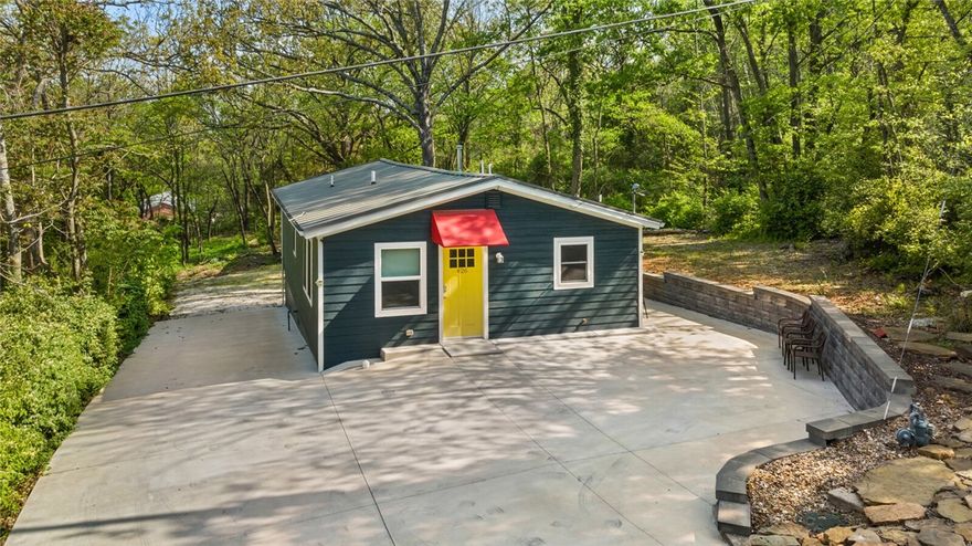 Enjoy all Fayetteville has to offer! This 1940s home has been meticulously remodeled down to the studs to include all modern systems including electrical, plumbing, and HVAC while maintaining its historic appeal. Step inside and onto strikingly handsome hardwood floors that cover the warm and welcoming living area. The exquisitely remodeled gourmet kitchen is a showstopper with stunning granite countertops, stylish subway tile backslash and stainless steel appliances. The custom, wood cabinets beautifully compliment the vintage feel of the home. Outside, step into the natural wooded surroundings of your property with a cement patio on three sides of the home. Conveniently located in the heart of Fayetteville, minutes from U of A, Wilson Park, Dickson Street, the Skull Creek Trail (Greenway) on North Street, and Razorback Stadium. This charming bangalow is currently being operated as a successful short-term rental (transferrable).