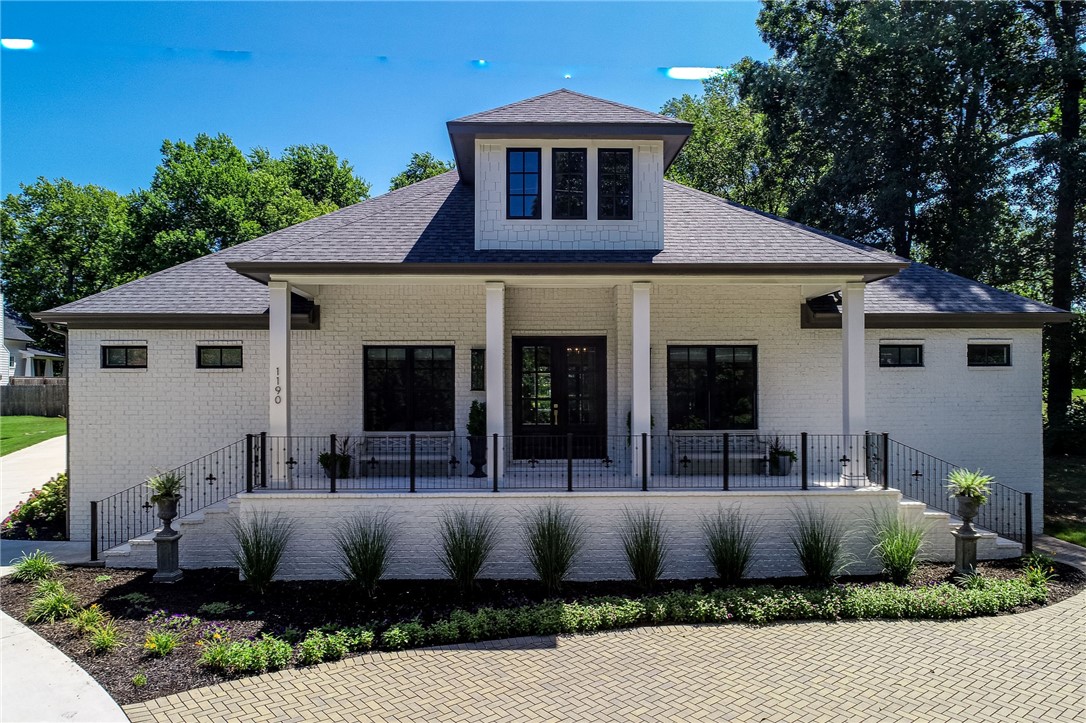 Exquisite custom home in the heart of Fayetteville near Wilson Park. Designer touches at every glance in this timeless traditional home. Stunning double French doors lead into the popular open living, kitchen, & dining concept. Kitchen boasts subzero refrigerator, Thermador dishwasher,6 burner Thermador stove, ice machine, walk-in pantry, & quartz counter tops! The living room with hardwood floors, fireplace, bult-ins, & abundant natural light, opens to fabulous outdoor living. Snuggle up in front of the fireplace & watch the hog game on your covered back porch. Den/office just off the main living area has a wet bar & mini fridge The oversized primary suite is situated on south end of home for privacy & has double walk-in closets, Carrara marble sinks, a huge walk-in shower & gorgeous soaking tub. A mother-in-law suite with full bath is tucked away in another area of home. Two bedrooms share an additional bath with walk-in shower. Utility room & back foyer add cabinets for great storage. Coveted 3 car garage.