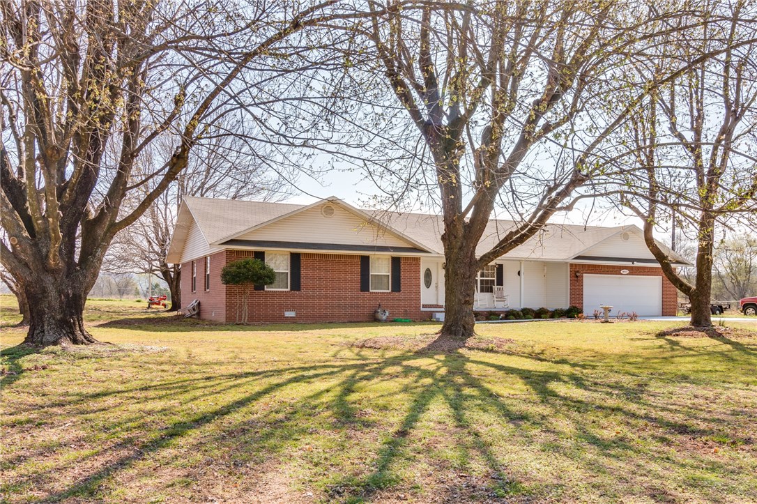 Great spot in the country! Creek frontage just across Latta Rd to create your own family picnic spot and swimming hole. Nicely maintained brick home with great kitchen for cooking and lots of built-ins throughout. Beautiful sunroom off the dining area, mature shade trees, storm celler just off sunroom for easy access. Small storage building perfect for mower and gardening tools. Close to fire dept and Morrow Country store! Add'l land available MLS: 1043229 (13.9 ac), 1043234 (2.74 ac), 1043236 (3.37 ac)