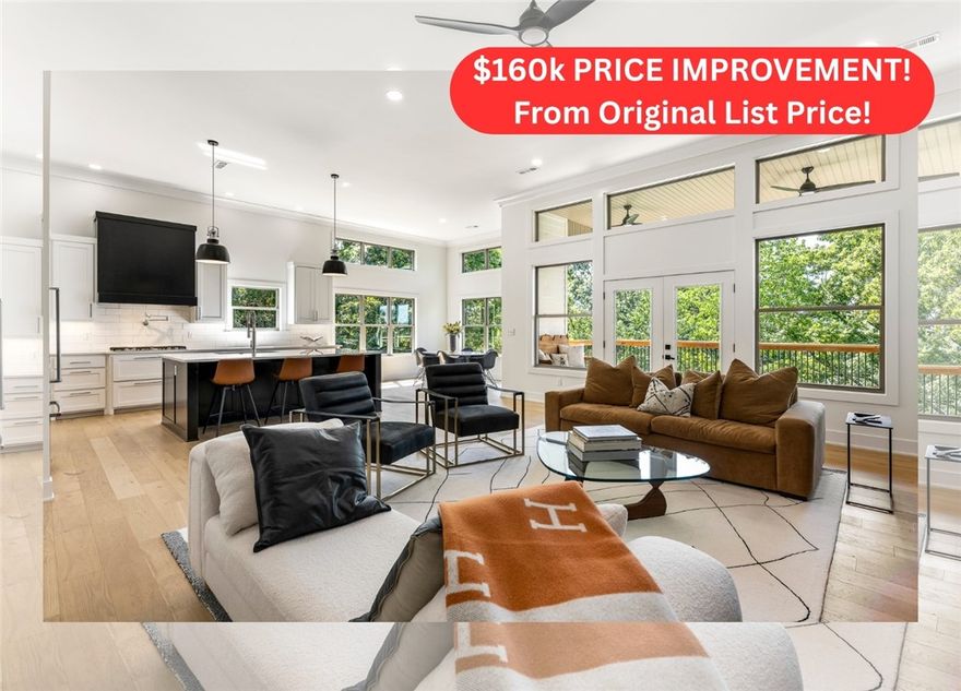 HUGE $160k PRICE REDUCTION from original price!! Live where adventure meets modern comfort. Just minutes from Coler Park, Airship Coffee, and miles of trails, this Bentonville home offers 4 bedrooms, 4.5 baths, and an open layout designed for connection. Double decks capture breathtaking sunsets and overlook a private, wooded yard.  Step inside or around back and you’ll discover its true scale — soaring ceilings, expansive living areas, and a dramatic rear elevation that makes the most of the natural slope. The chef’s kitchen features quartz counters, premium appliances, a large island, and a butler’s pantry made for entertaining. The primary suite offers expansive windows and boasts a spa-like bath and walk-in closet. A finished walk-out lower level offers endless possibilities—game room, media room, gym, or wine cellar. Modern living in the heart of Bentonville.