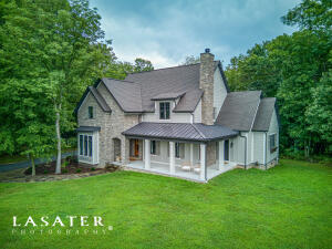 Unbelievable detail and quality of construction with this 4239 SF, 4BR, 3.5BATH home just a short distance from the Valley Springs School. Setting on 12.36 acres with 6 ac of hay pasture making it perfect for a few horses or livestock. Features of the open floor plan house includes engineered hard wood hickory flooring throughout, custom lighted cabinets (with quartz counter tops) and vanities, wood burning fire place (currently with a propane insert), 9' ceilings, high end Anderson windows & doors, Thermadoor propane commercial grade cooking range, 2 game rooms, office, screened in back porch, large 3 car garage (with workshop area), blue tooth whole house sound system, Hardy Board & native stone siding. Outside includes raised beds for your garden and fenced in chicken coop/dog pen.