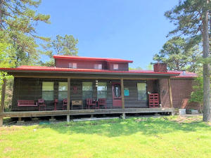 A quiet secluded home on 14 acres M/L with a stock pond, 2000 sq.ft 3 BR 2 Bath home w/2 car garage, large shop and Strg. Blds. Some pasture. A/C unit only 4 yrs old, New metal roof in 2012.