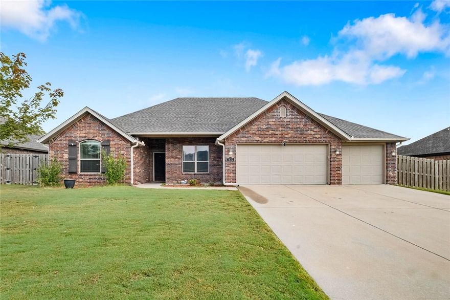 Location Location Location! Welcome home to this rare find of a 5 bedroom full brick home with a three car garage!  All new paint in Oct 2025, New LVP flooring throughout Oct 2025. New Roof! Living room boasts soaring  ceilings with recessed lighting, spaciously accented with gas log fireplace brick,and crown molding trim.  Large Kitchen with Granite countertops framed with elevated bar seating.  Stainless appliances: Range includes gas cooktop with convection oven, microwave above stove. Primary suite has dual vanity, corner whirlpool, walk in separate shower.   large lot with covered patio and wood privacy fencing.  Conveniently  located near Har Ber High school, multiple  restaurants, pharmacy, Tontitown winery and more.  Priced to sell  Washer, Dryer, Refrigerator can be negotiable with a full price offer.