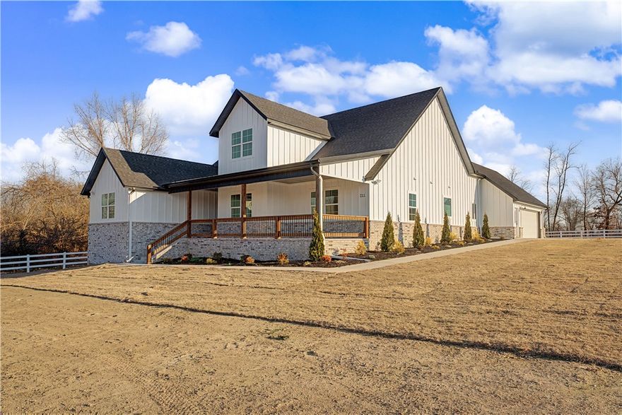 This is the one you've been waiting for! Brand new construction 3489 sq ft home plus a versatile shop on a full one acre lot. No HOA in a PRIME Bentonville Location. Located in a country setting but minutes to all things entertainment. This home offers 3 large bedrooms and 3 bathrooms downstairs plus an office and a bedroom and bathroom upstairs that could also be used as a bonus space. Large covered front porch plus a covered back porch with a second fireplace for cozy nights by the fire. Open layout perfect for entertaining. Gorgeous kitchen with a stained island, cabinetry that goes all the way to the ceiling, double oven, gas stove, and a hidden pantry. The approximate 1000 sq ft Shop includes a 3/4 bathroom and could be used for a gym, hobby room, storage, or whatever fits your needs. Mini Spilt and electric in the shop ready for you to  make your own. Property next door is also listed with a separate MLS number if you desire both. Open House both Saturday and Sunday 2-4.