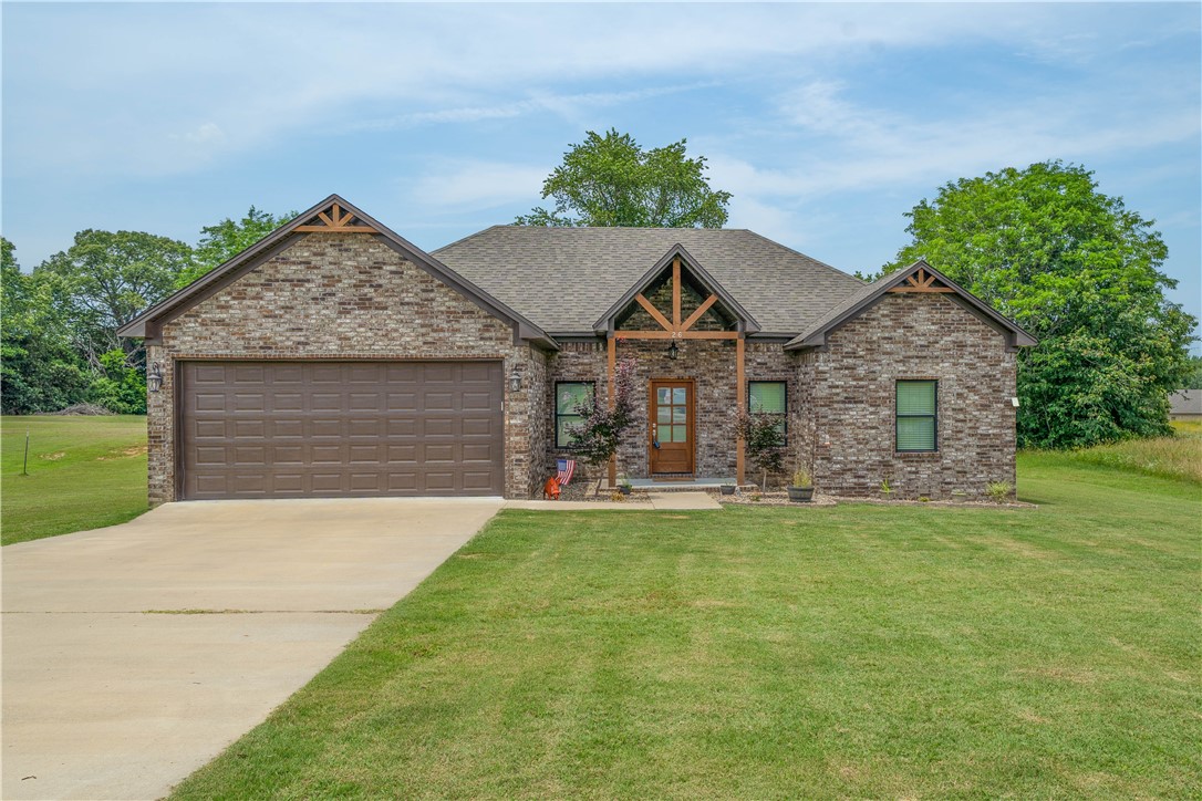 Built in 2021, this charming home on 1.38 acres offers a split floor plan, open-concept living. Kitchen has wood shaker style cabinets, granite countertops, SS appliances, open to living area with LVP flooring throughout - combining durability with style. The spacious primary suite features a large walk-in closet connected to the laundry room for added convenience. The primary bathroom shower features garden soaker tub, updated tile work, a rainfall shower-head, and a standard shower-head for a spa-like experience. Located in a rural neighborhood with easy access to nearby amenities. Enjoy modern living with country charm - and it qualifies for 100% financing!