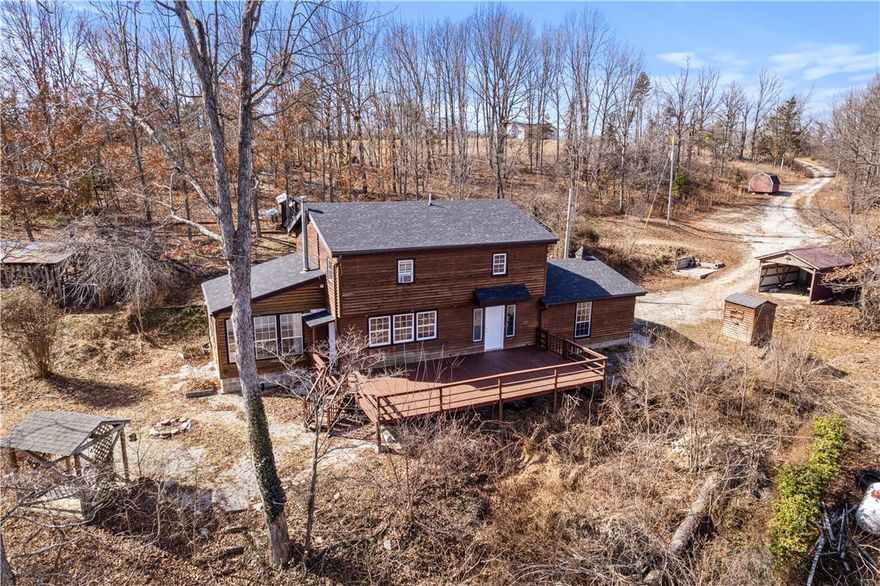 Beautiful 3 bed, 3 bath two-story home offering 1,996 sqft on 9.10 acres PLUS an additional .86-acre lot that has water & electric hook ups already onsite. (so much potential for this lot) The main level features an open living space filled with natural light, along with a versatile bonus room perfect for a home office, game room, or second living area. All bedrooms are located upstairs. Recent interior updates include new drywall and trim, fresh paint, butcher block countertops, ceiling fans, refinished wood floors, LVP flooring in the bathrooms, and a new roof (2024). The home also includes a whole-house reverse osmosis water system, kitchen appliances (including refrigerator) Outside, you’ll find outbuildings, a chicken coop, fruit trees, and plenty of room for exploring! Second floor AC unit is not currently operational. First floor unit and both level heat pump systems are operational. This home and the land has so much to offer and ready for you!