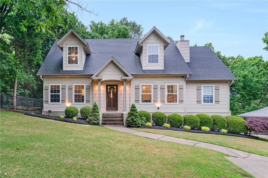 Prime Location in Fayetteville! This beautifully designed home is near Wilson Park, Dickson St and the Greenway, offering comfort, flexibility and a versatile layout in a highly desirable area. The main level features an inviting living space that flows seamlessly into the dining and kitchen, creating an ideal setup for both everyday living and entertaining. A bedroom and full bath on the main floor provide flexibility for guests or a home office. Upstairs, you’ll find additional bedrooms including a spacious primary suite featuring a walk-in closet, private full bath and a dedicated storage room with attic access, while the remaining bedrooms provide flexible space for family, guests, hobbies or a work-from-home setup. Step outside to enjoy the covered back deck overlooking the backyard—perfect for relaxing, entertaining or enjoying the outdoors year-round. Conveniently located near the University of Arkansas, parks, shopping, dining and entertainment, this home blends convenience and local charm.