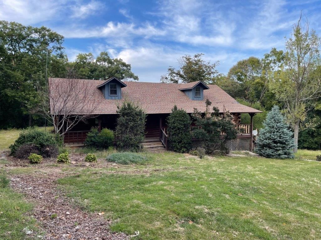 Custom built log home located on over 9 wooded and secluded acres near the Hillspeak area south of town. Renovation will make this a great place to call home. Minutes from everything Eureka Springs has to offer. Great opportunity! Utilities are not on, and water cannot be turned on inspection. Sold as-is.