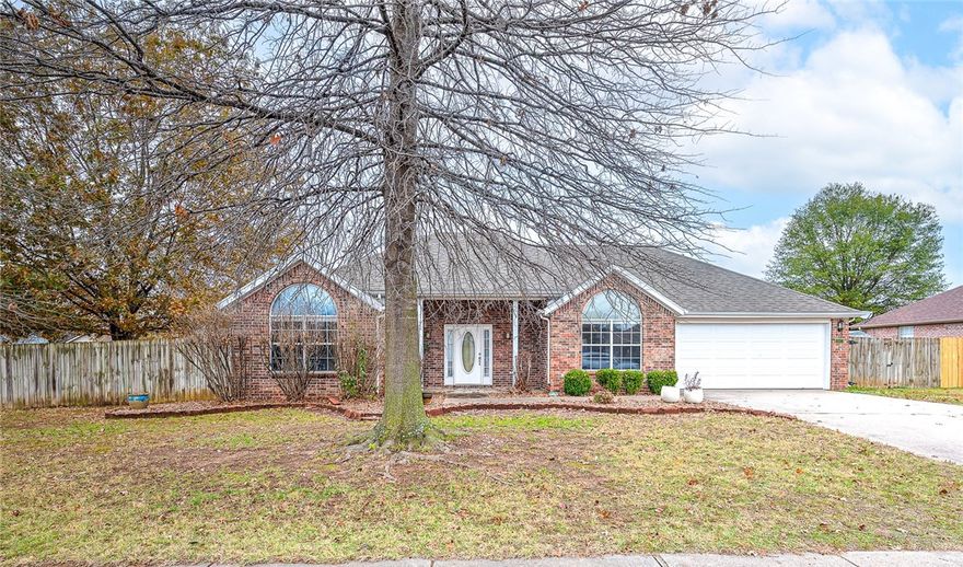 Welcome to 3130 Woodbridge Rd, a charming and well-kept home set on a large corner lot in one of Johnson/Springdale’s most convenient locations. This three-bedroom house features a true split floorplan, giving the private suite and secondary bedrooms comfortable separation while keeping the main living spaces connected and easy to enjoy. Inside, you’ll love the warmth of the acacia hardwood floors, paired with fresh, updated paint that makes the whole home feel bright and inviting. The layout offers a relaxed flow for everyday living, with plenty of room to gather, work, or unwind. Step outside to a generous yard with mature trees and space to garden, play, or entertain—an uncommon find for this area. Large shed conveys. Minutes from I-49, schools, shopping, and all the essentials, 3130 Woodbridge combines a standout location with thoughtful updates and a floorplan that works well for so many!