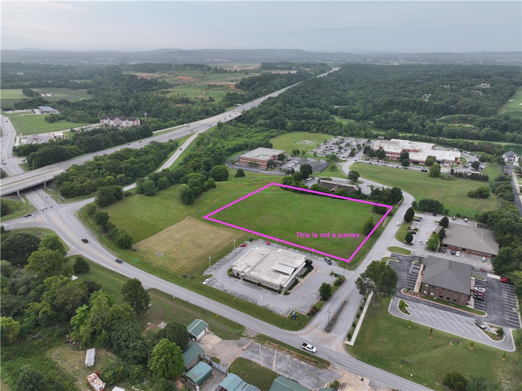 Opportunity to own property right off of I-49. Convenience and accessibility to everything Northwest Arkansas doesn't present itself often. Currently zoned TC. The property consist of 3.26 +/- acres of flat ready to build ground. Utilities are at the street. Also apart of MLS 1309149