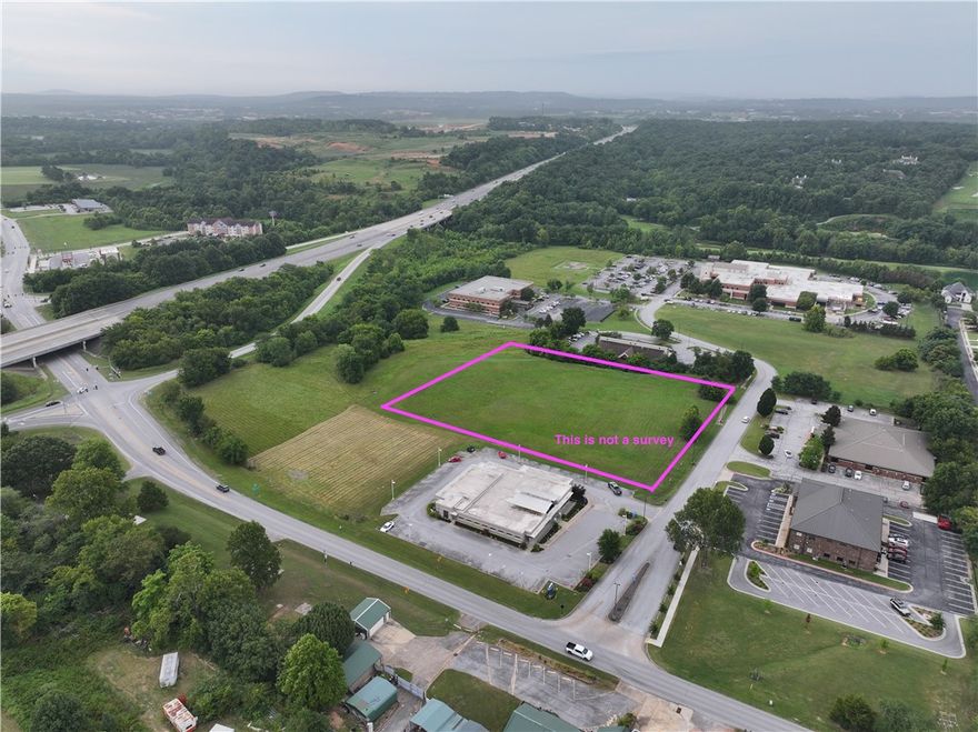Opportunity to own property right off of I-49. Convenience and accessibility to everything Northwest Arkansas doesn't present itself often. Currently zoned TC. The property consist of 3.26 +/- acres of flat ready to build ground. Utilities are at the street.  See MLS 1307608, MLS 1326767, MLS 1326773