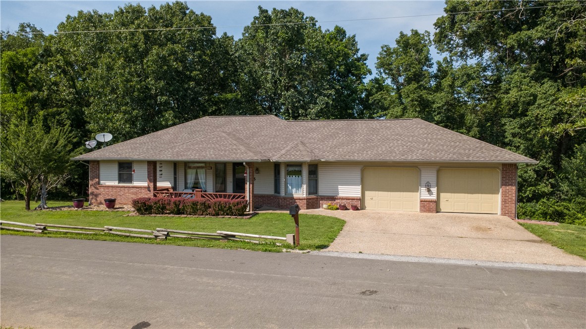 Own this secluded park like setting nestled on a private cul-de-sac surrounded by common property. Yet you are only 15 minutes to town. Choose from two decks or a front porch to enjoy the views. Large bay windows as well as a sunroom. The well-designed kitchen has plenty of cabinet storage with pull out drawers, 2 pull out bread boards and a bar area. Natural light bathes the bathrooms through skylights. Two larger bedrooms and an office or 3 bedrooms if needed. An oversized 2 car garage and 12 x 16 loft barn give abundant storage. If you need more space, there is an additional heated and cooled 496sq feet in the basement that is an excellent workroom. Accessible from inside the garage. Dual furnace electric or propane. (transferable warranty) Home is on a 2 bedroom 750 gallon septic system.